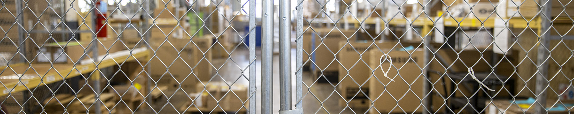 Chainlink fencing containing stored materials in the U Market warehouse